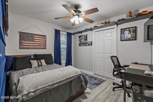11214 Bentley Trace Ln E, Jacksonville, FL 32257 - bedroom featuring light wood-type flooring, a desk, a closet, ceiling fan, and baseboards