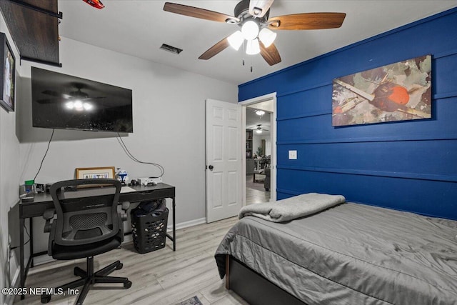 11214 Bentley Trace Ln E, Jacksonville, FL 32257 - bedroom with wood finished floors, a desk, baseboards, and a ceiling fan