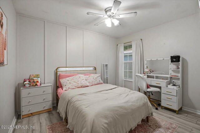 11214 Bentley Trace Ln E, Jacksonville, FL 32257 - bedroom with light wood-type flooring, ceiling fan, and baseboards