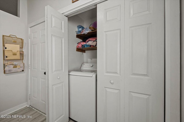 11214 Bentley Trace Ln E, Jacksonville, FL 32257 - laundry area with washer / dryer, light wood-style floors, and baseboards