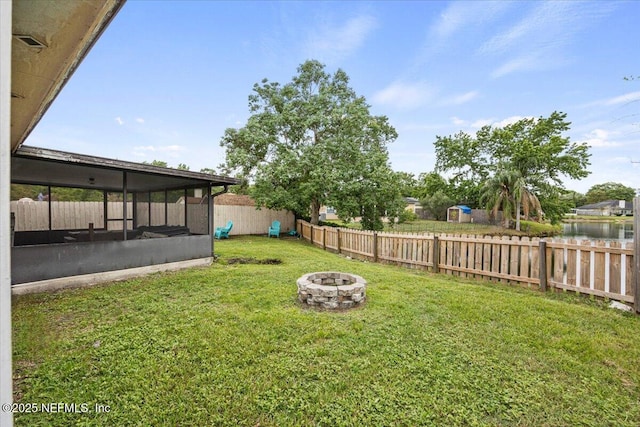 11214 Bentley Trace Ln E, Jacksonville, FL 32257 - view of yard featuring a sunroom and an outdoor fire pit