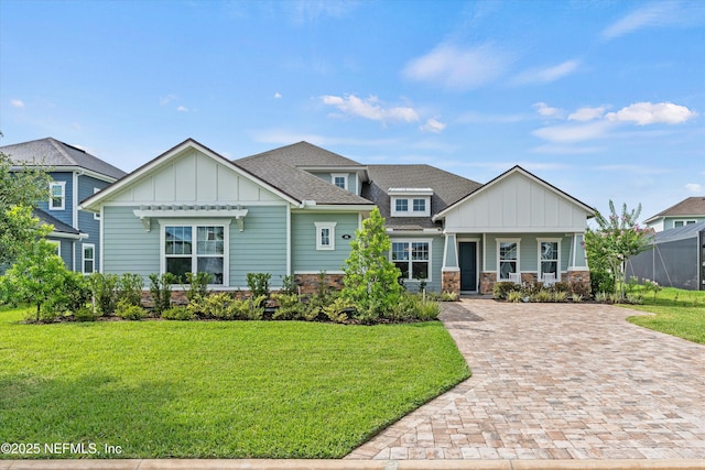 46 Hydrilla Ct, Saint Augustine, FL 32095 - craftsman inspired home with board and batten siding, stone siding, and a front lawn