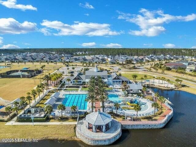 46 Hydrilla Ct, Saint Augustine, FL 32095 - aerial perspective of suburban area featuring a pool area and a large body of water