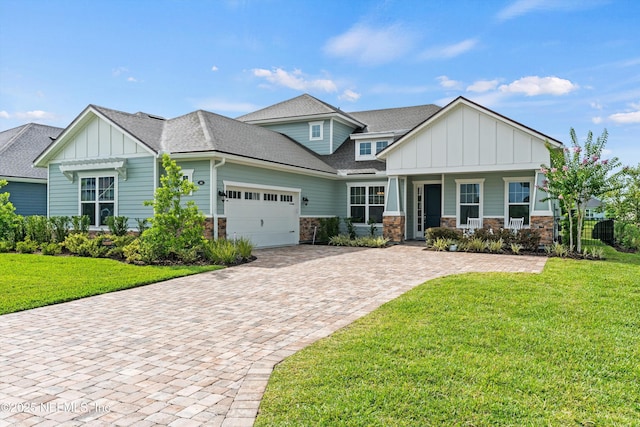 46 Hydrilla Ct, Saint Augustine, FL 32095 - craftsman house with board and batten siding, a garage, a front lawn, and stone siding