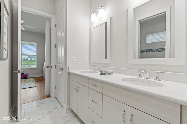 46 Hydrilla Ct, Saint Augustine, FL 32095 - full bathroom featuring double vanity and marble finish flooring