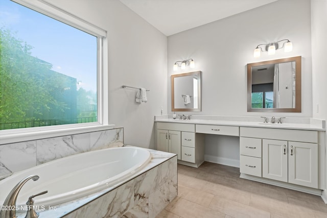 46 Hydrilla Ct, Saint Augustine, FL 32095 - bathroom with double vanity, a garden tub, and healthy amount of natural light
