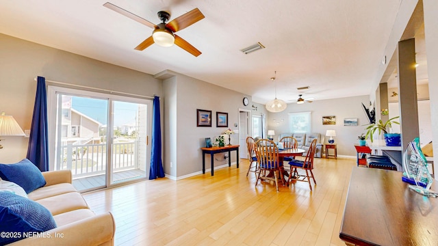 23 Moody Dr, Palm Coast, FL 32137 - dining space featuring ceiling fan, light wood-type flooring, and baseboards