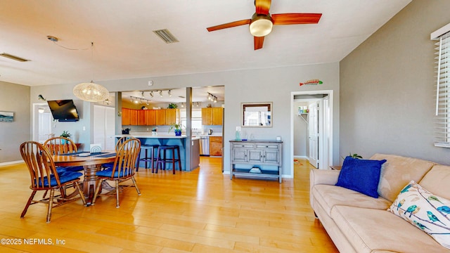 23 Moody Dr, Palm Coast, FL 32137 - living area featuring light wood finished floors, a ceiling fan, and baseboards