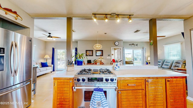 23 Moody Dr, Palm Coast, FL 32137 - kitchen with stainless steel appliances, open floor plan, ceiling fan, and plenty of natural light