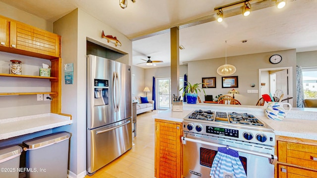 23 Moody Dr, Palm Coast, FL 32137 - kitchen with appliances with stainless steel finishes, ceiling fan, light countertops, hanging light fixtures, and light wood-style floors