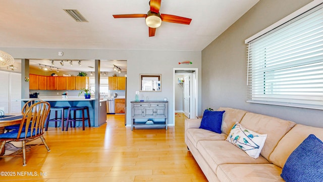 23 Moody Dr, Palm Coast, FL 32137 - living room with plenty of natural light, light wood-style flooring, and a ceiling fan