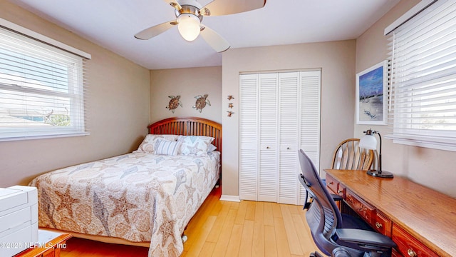 23 Moody Dr, Palm Coast, FL 32137 - bedroom with light wood-style floors, a closet, a desk, and a ceiling fan