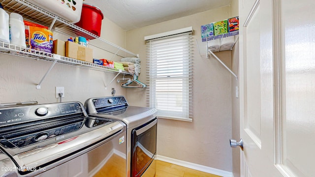 23 Moody Dr, Palm Coast, FL 32137 - washroom with washing machine and clothes dryer and baseboards