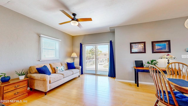23 Moody Dr, Palm Coast, FL 32137 - living area featuring ceiling fan, plenty of natural light, and light wood-type flooring