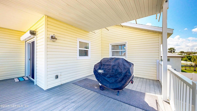 23 Moody Dr, Palm Coast, FL 32137 - wooden deck featuring a grill