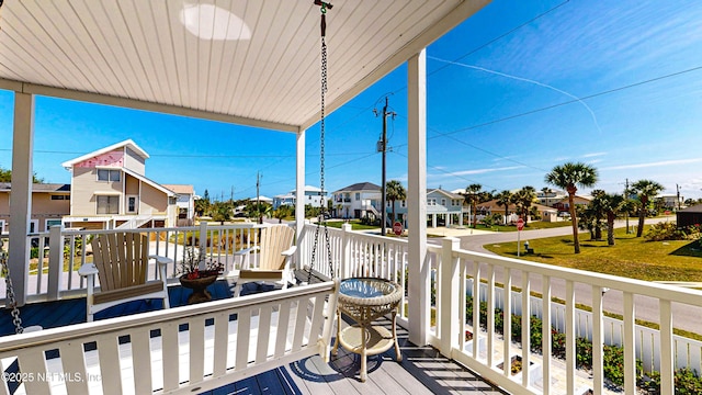 23 Moody Dr, Palm Coast, FL 32137 - covered porch featuring a residential view