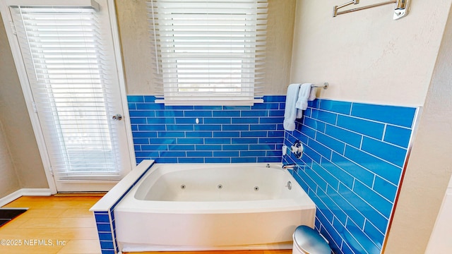 23 Moody Dr, Palm Coast, FL 32137 - bathroom with a jetted tub and tile walls