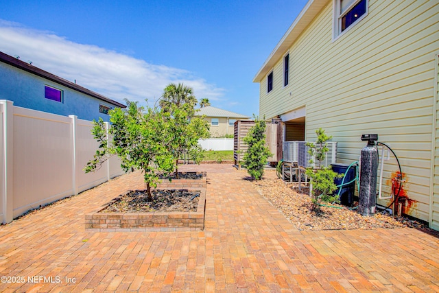 23 Moody Dr, Palm Coast, FL 32137 - fenced backyard featuring a patio area and a garden