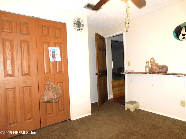 2718 Tina Ln, Middleburg, FL 32068 - entrance foyer with dark carpet, a ceiling fan, and baseboards