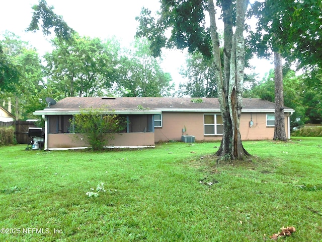 2718 Tina Ln, Middleburg, FL 32068 - rear view of property featuring a sunroom, central air condition unit, and a yard