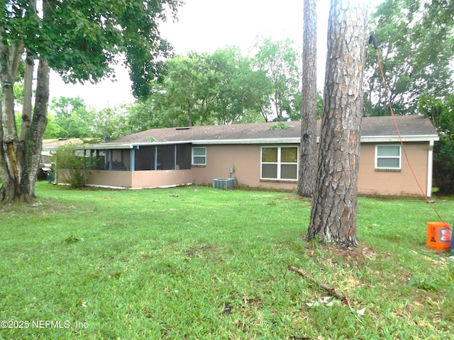 2718 Tina Ln, Middleburg, FL 32068 - back of house featuring a sunroom, central air condition unit, a yard, and concrete block siding