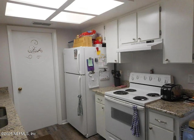 7670 SW 112th Ln, Ocala, FL 34476 - kitchen with white appliances, under cabinet range hood, white cabinets, and dark wood finished floors