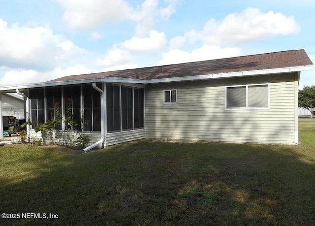 7670 SW 112th Ln, Ocala, FL 34476 - rear view of house with a sunroom and a yard