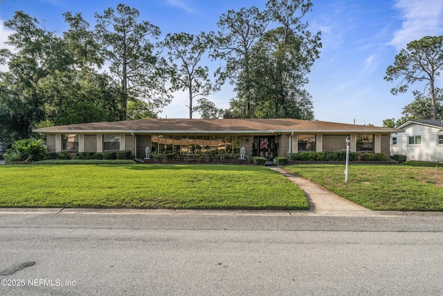 2364 Smullian Trl S, Jacksonville, FL 32217 - ranch-style house with a front lawn and brick siding