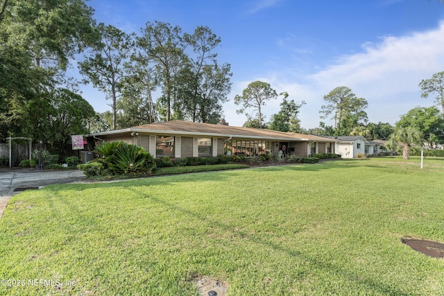 2364 Smullian Trl S, Jacksonville, FL 32217 - ranch-style home featuring a front lawn and brick siding