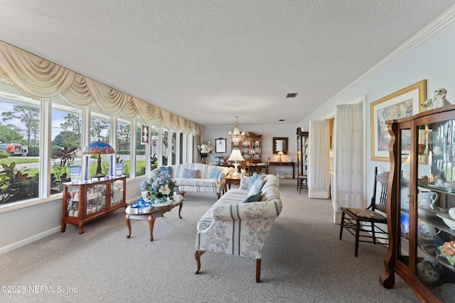 2364 Smullian Trl S, Jacksonville, FL 32217 - living room featuring a chandelier, carpet flooring, a textured ceiling, baseboards, and crown molding