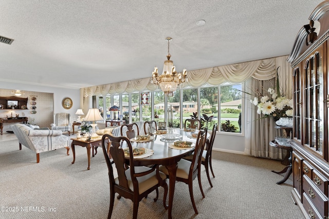 2364 Smullian Trl S, Jacksonville, FL 32217 - carpeted dining space with a chandelier, plenty of natural light, and a textured ceiling