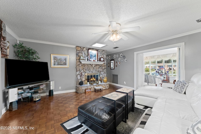 2364 Smullian Trl S, Jacksonville, FL 32217 - living area featuring ceiling fan, baseboards, a textured ceiling, a stone fireplace, and crown molding
