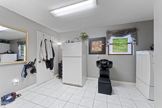 2364 Smullian Trl S, Jacksonville, FL 32217 - interior space featuring a textured ceiling, washer / dryer, and baseboards
