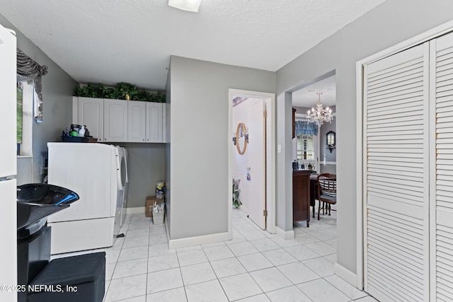 2364 Smullian Trl S, Jacksonville, FL 32217 - kitchen with refrigerator, a chandelier, baseboards, light tile patterned floors, and a textured ceiling