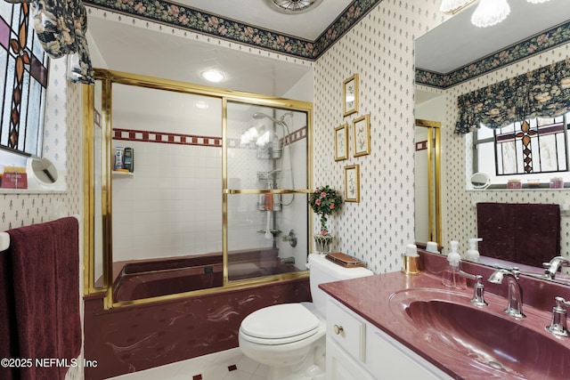 2364 Smullian Trl S, Jacksonville, FL 32217 - full bath featuring wallpapered walls, vanity, shower / bath combination with glass door, tile patterned flooring, and toilet
