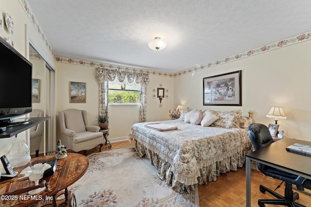 2364 Smullian Trl S, Jacksonville, FL 32217 - bedroom with an office area, a closet, and a textured ceiling