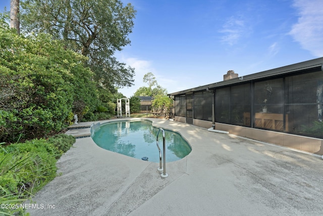 2364 Smullian Trl S, Jacksonville, FL 32217 - swimming pool featuring a patio and a sunroom
