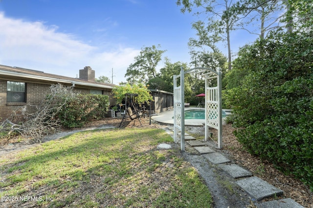 2364 Smullian Trl S, Jacksonville, FL 32217 - view of grassy yard featuring an outdoor pool