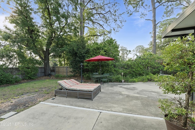 2364 Smullian Trl S, Jacksonville, FL 32217 - fenced backyard featuring outdoor dining area and a patio