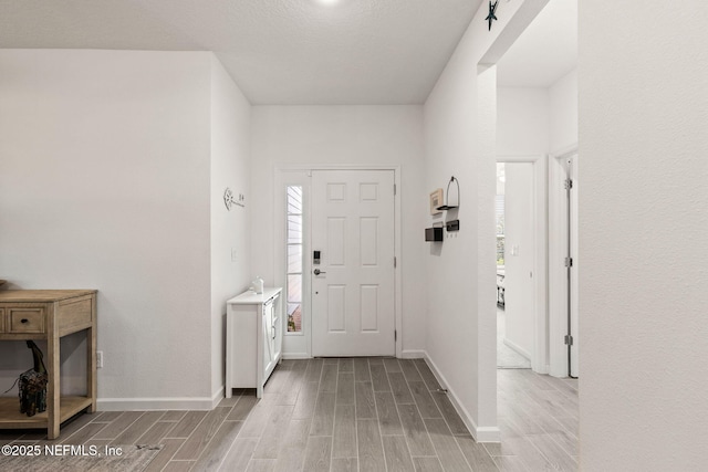 85600 Stonehurst Pkwy, Fernandina Beach, FL 32034 - entryway featuring light wood finished floors and baseboards