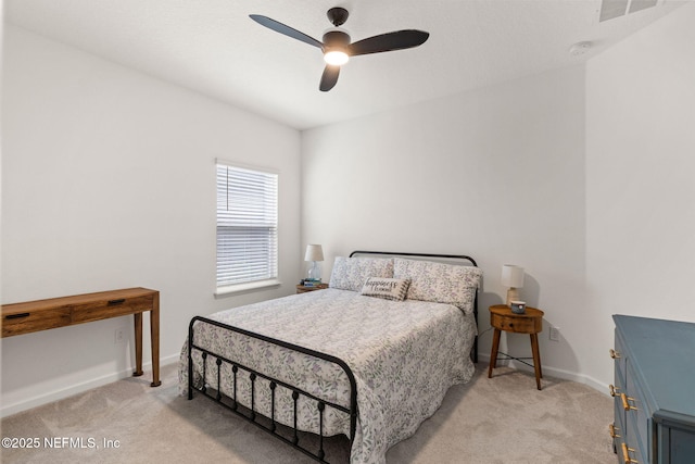 85600 Stonehurst Pkwy, Fernandina Beach, FL 32034 - bedroom with light carpet, baseboards, and a ceiling fan