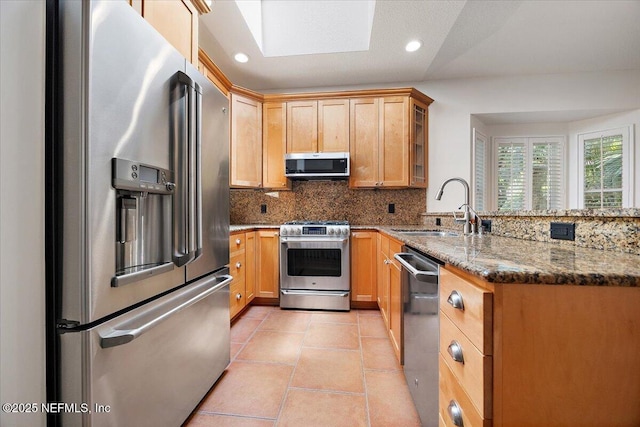 2049 Seminole Rd, Atlantic Beach, FL 32233 - kitchen featuring appliances with stainless steel finishes, a peninsula, tasteful backsplash, stone counters, and recessed lighting