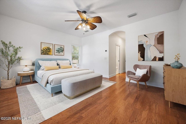 2049 Seminole Rd, Atlantic Beach, FL 32233 - bedroom featuring arched walkways, wood finished floors, and ceiling fan