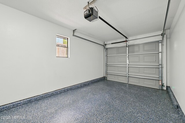 494 Acacia St, Saint Augustine Beach, FL 32080 - garage with a garage door opener and baseboards