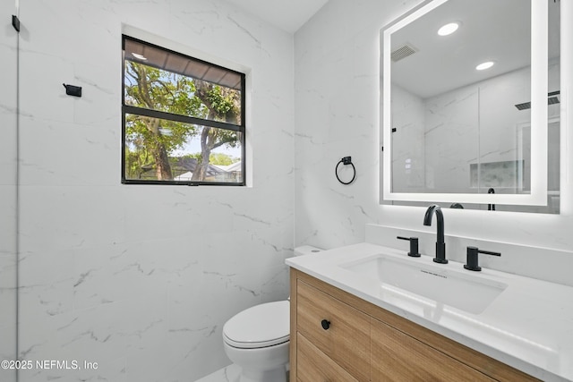 494 Acacia St, Saint Augustine Beach, FL 32080 - bathroom featuring vanity, toilet, and recessed lighting