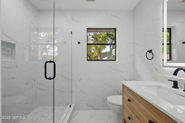 494 Acacia St, Saint Augustine Beach, FL 32080 - full bath featuring vanity, toilet, and a marble finish shower