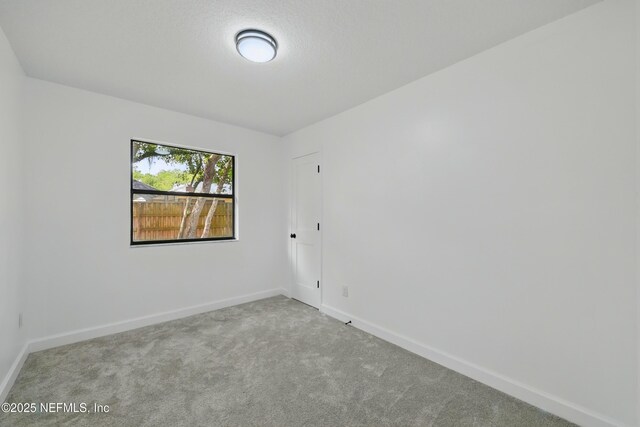 494 Acacia St, Saint Augustine Beach, FL 32080 - unfurnished room featuring carpet floors and baseboards