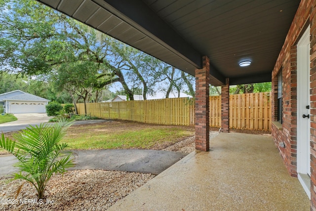 494 Acacia St, Saint Augustine Beach, FL 32080 - view of patio featuring a garage
