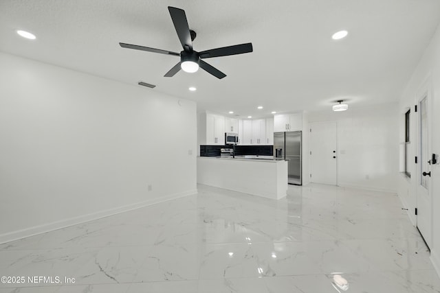 494 Acacia St, Saint Augustine Beach, FL 32080 - unfurnished living room featuring recessed lighting, ceiling fan, baseboards, and light marble finish flooring
