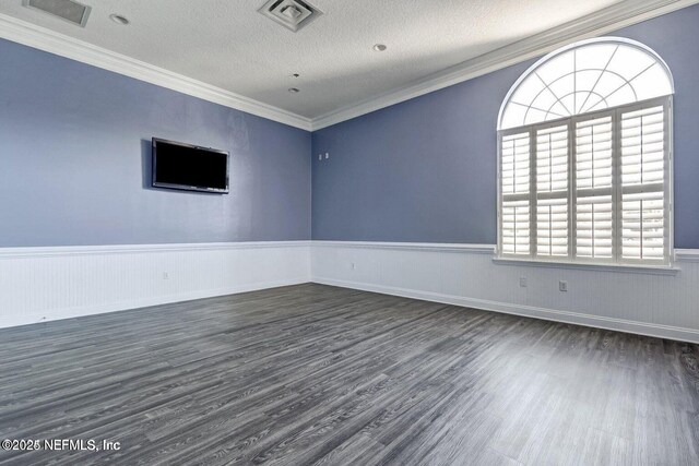 5006 Key Lime Dr Unit 306, Jacksonville, FL 32256 - spare room with dark wood-type flooring, wainscoting, a textured ceiling, and crown molding